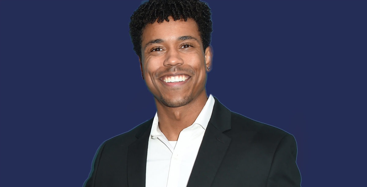 general hospital star tajh bellow smiling against a blue background