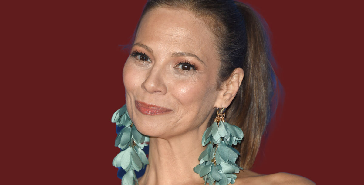 tamara braun from days of our lives and general hospital with a ponytail and long earrings.