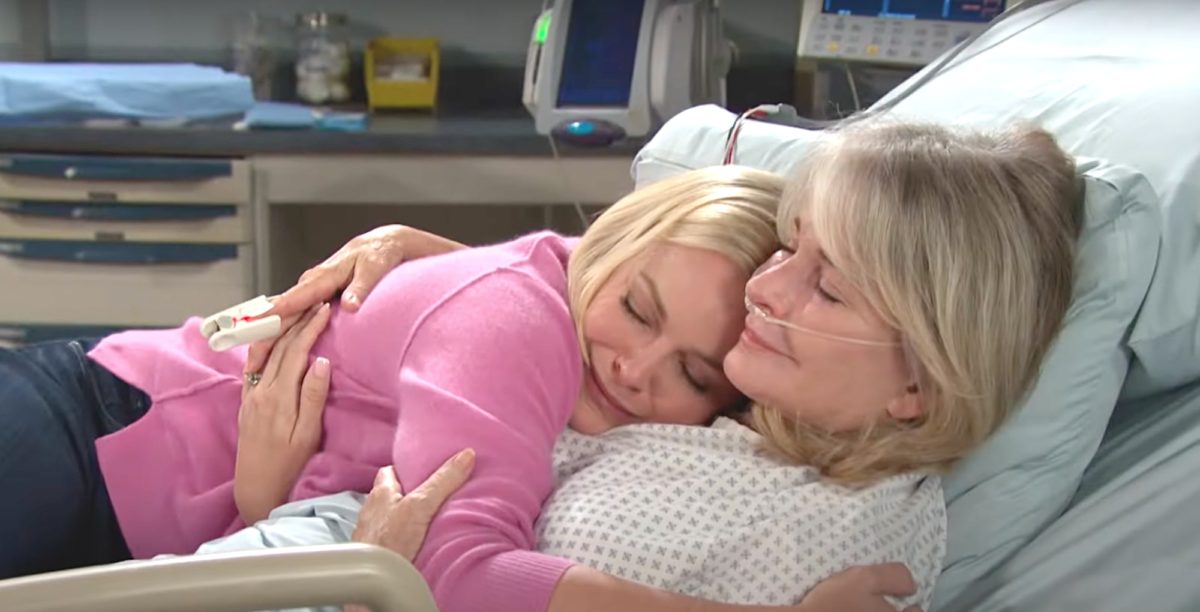 days of our lives spoilers belle, wearing pink, is hugging her mom, marlena, in her hospital bed