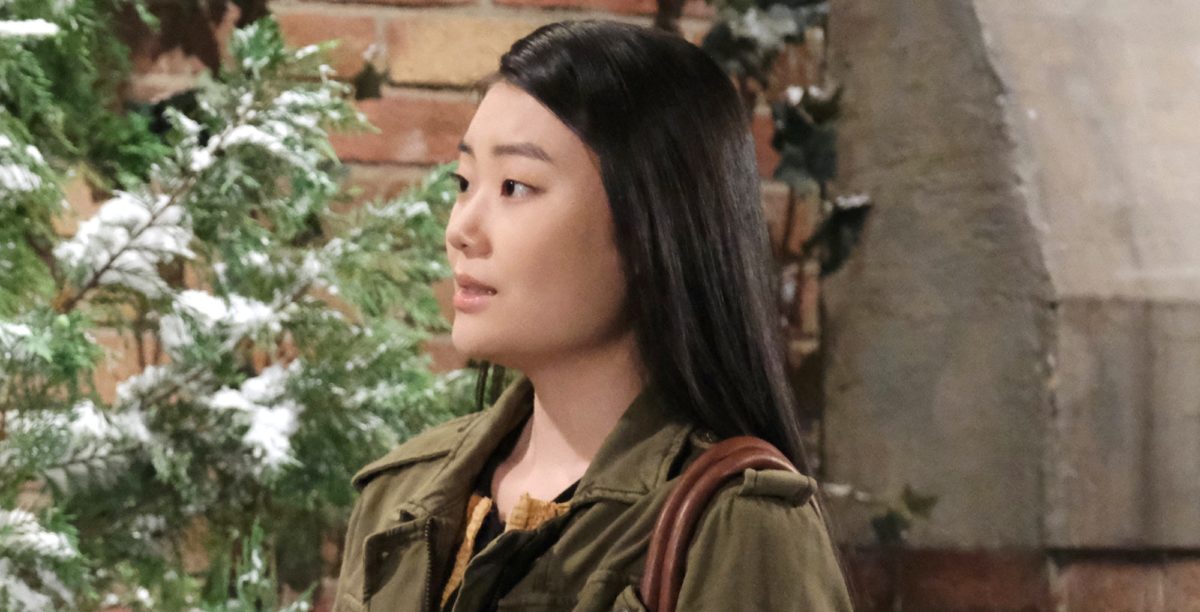 days of our lives spoilers wendy shin wearing a purse with snowy plant in back of her