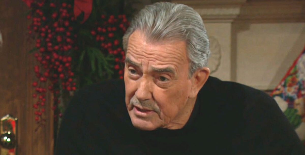 young and the restless spoilers have victor newman wearing black with a wood cabinet, wall in back