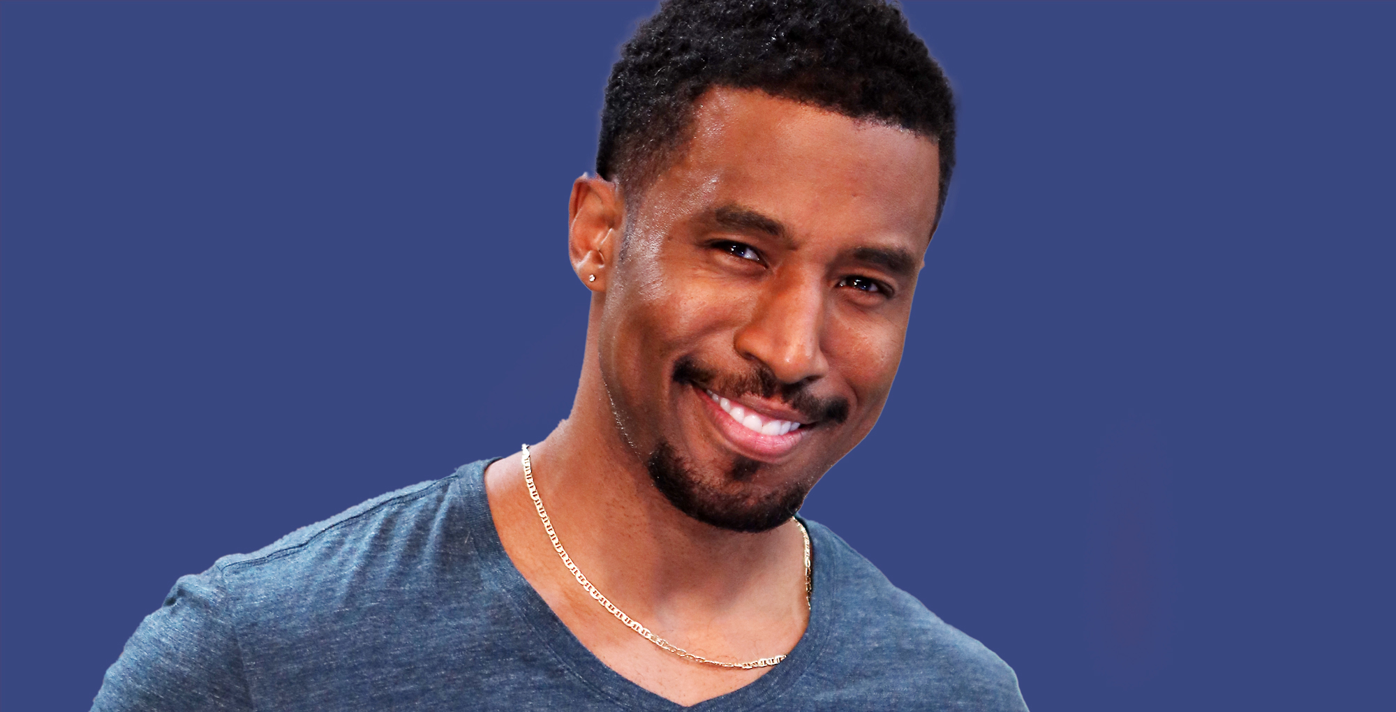 gavin houston who plays zeke on general hospital against a blue background.