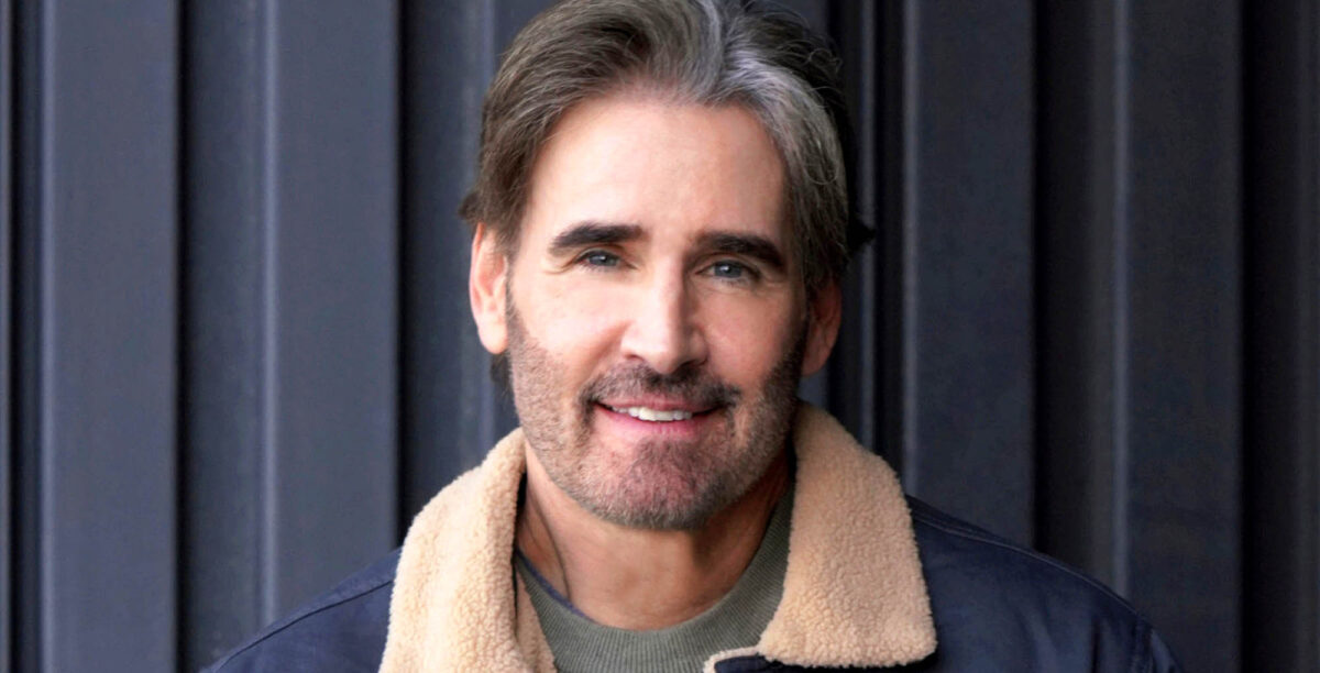 j. eddie peck, who portrays cole howard on young and the restless, against a dark backgroun.