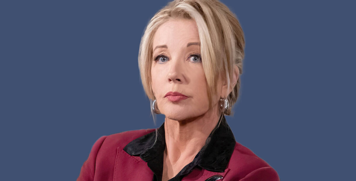 melody thomas scott the young and the restless wearing a red jacket against a blue background.