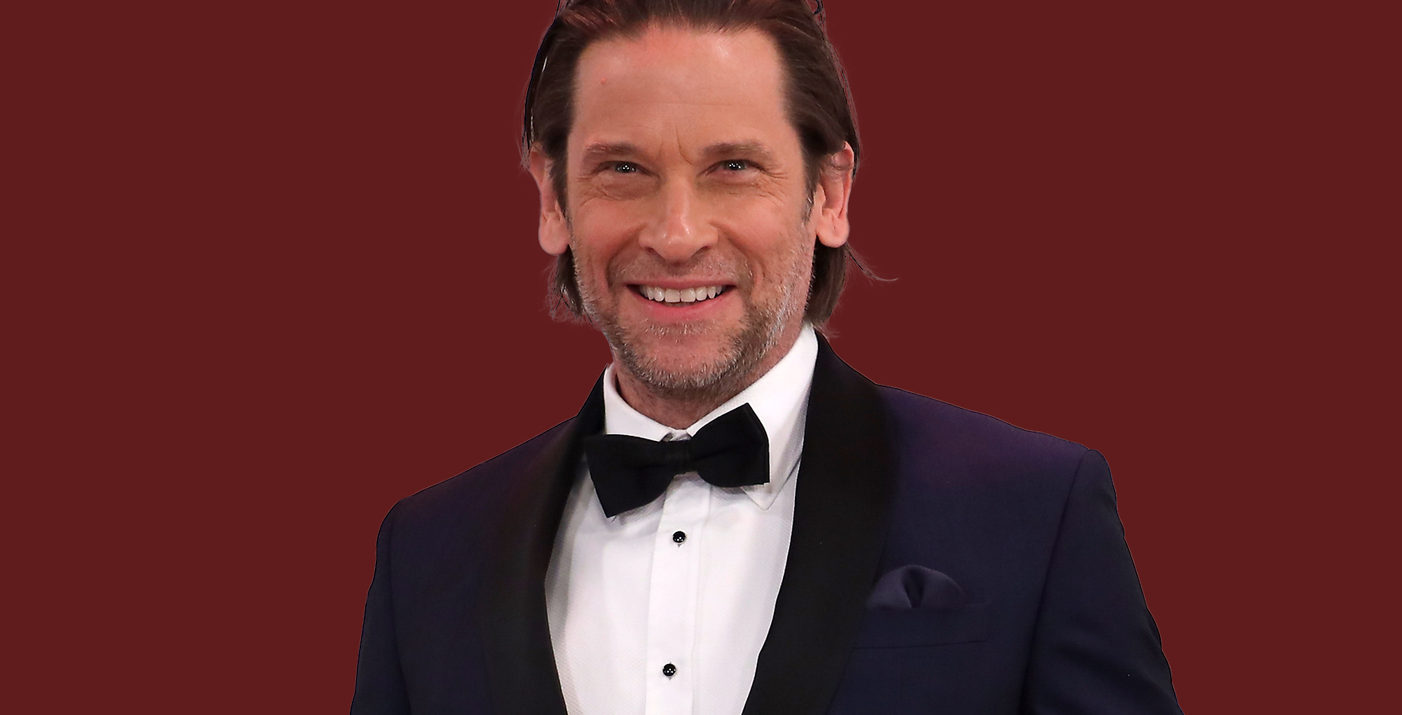 roger howarth wearing a tux and smiling.