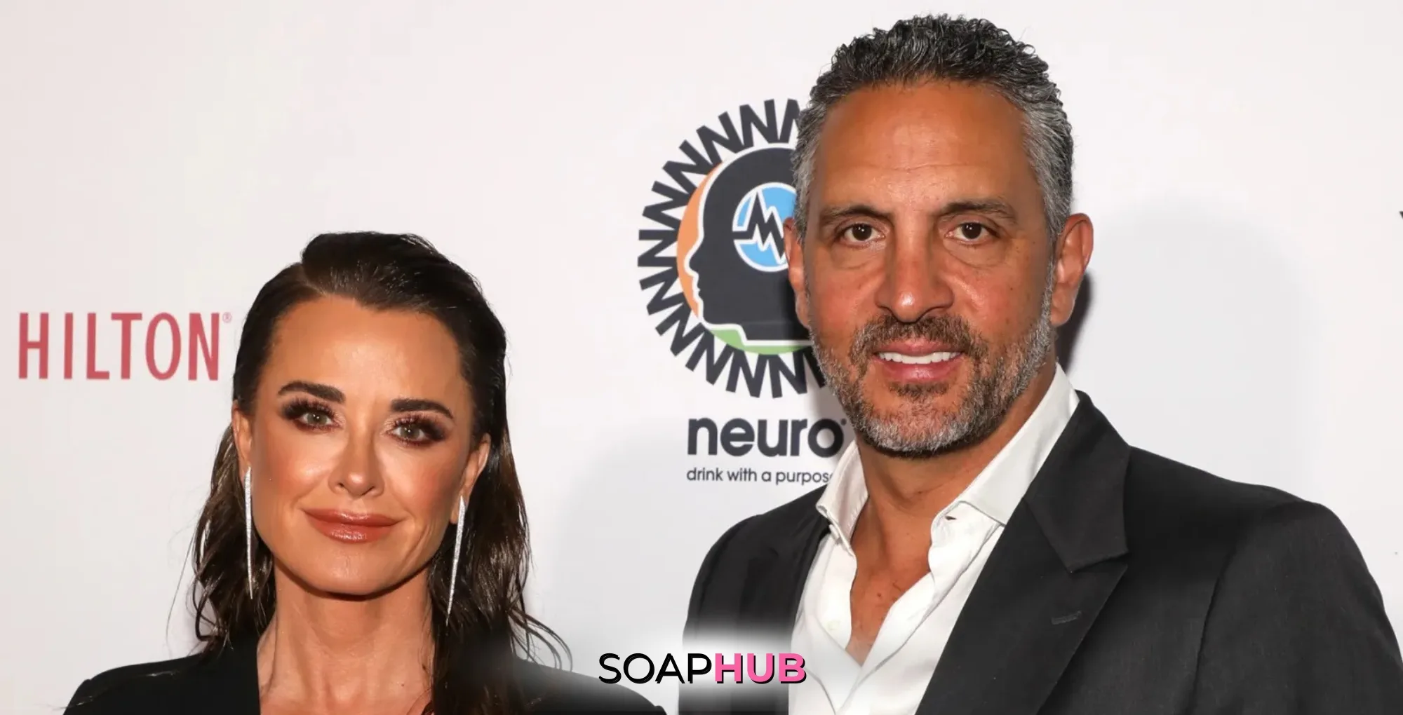 Kyle Richards and Mauricio Umansky with the Soap Hub logo.