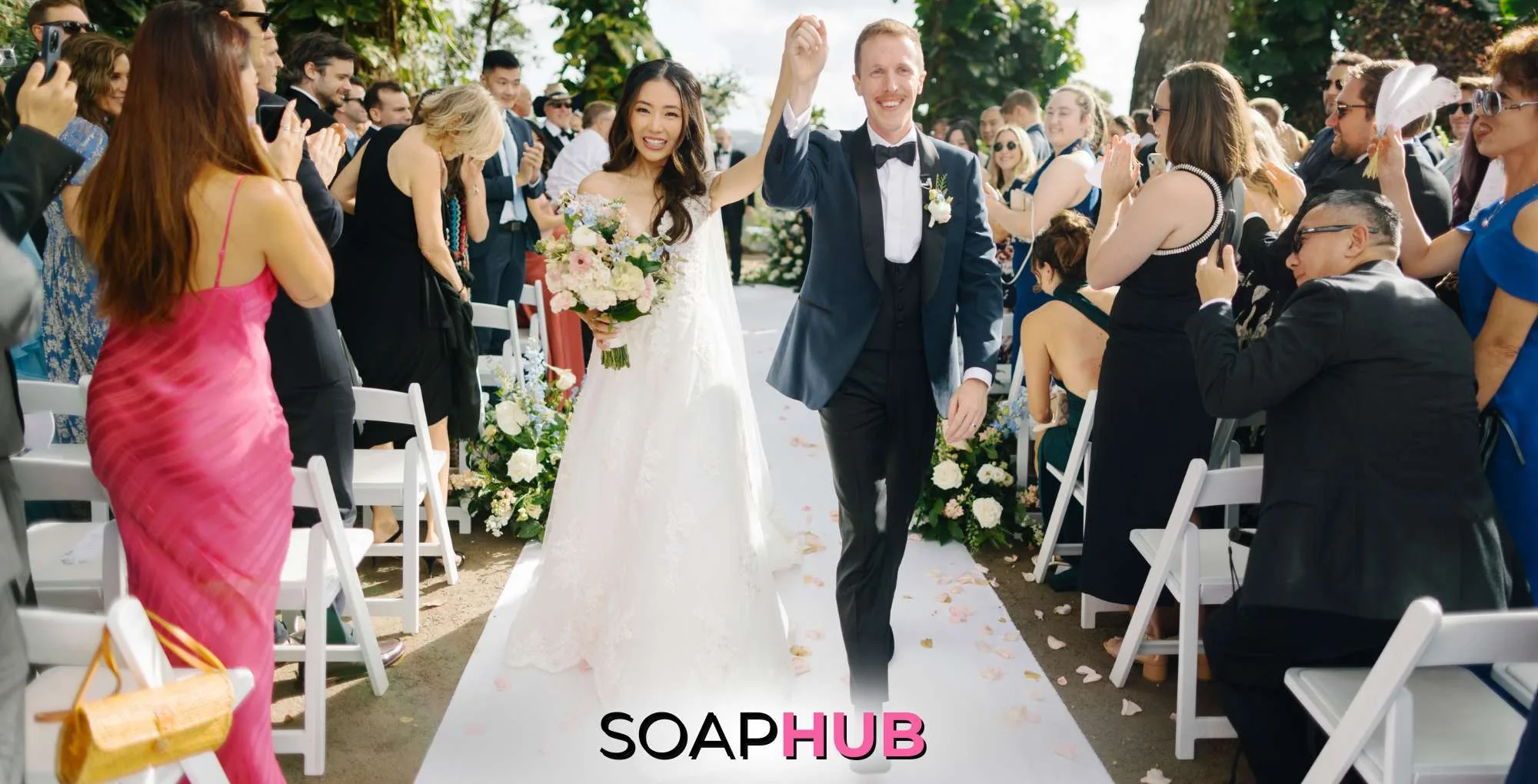 The Young and the Restless alum Kelsey Wang and her husband Max Gordon at their wedding with the Soap Hub logo.