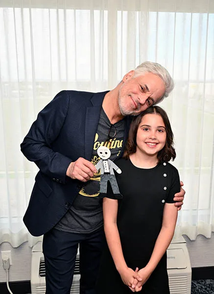 Christian Le Blanc receives a Mini Christian from fan Mira Grondin.