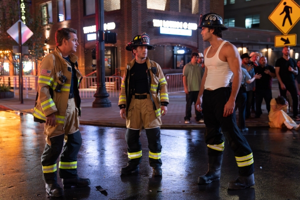 L-R: Chris O'Donnell as Don Hart, Michael Provost as Ryan Hart, and Hunter McVey as Blue Bennings. They're in firefighter gear standing in the street at night. 911: Nashville.