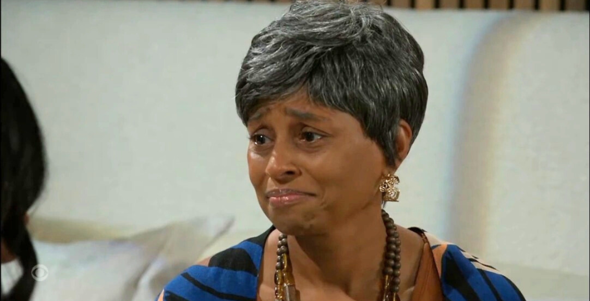 Beyond The Gates character Peaches in Leslie's apartment.