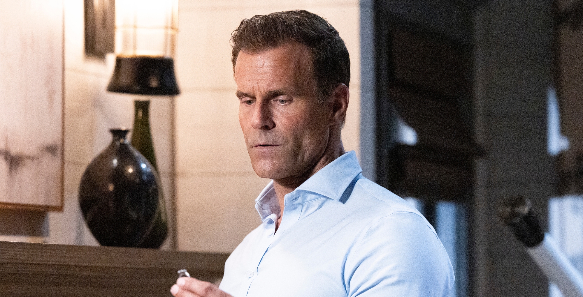 General Hospital's Drew looking at a ring.