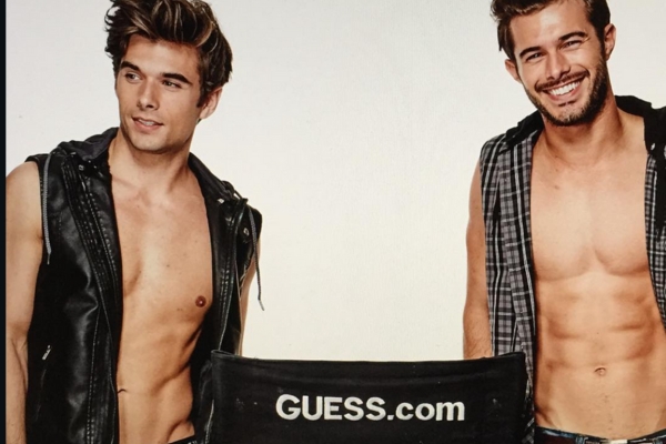 Actor Josh Swickard and model Alex Prange in an ad for Guess