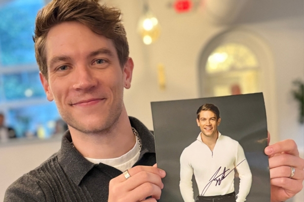 Y&R's Lucas Adams (Noah) holds up an autographed 8x10 at a fan event thrown by Star Stuck Fan Events.
